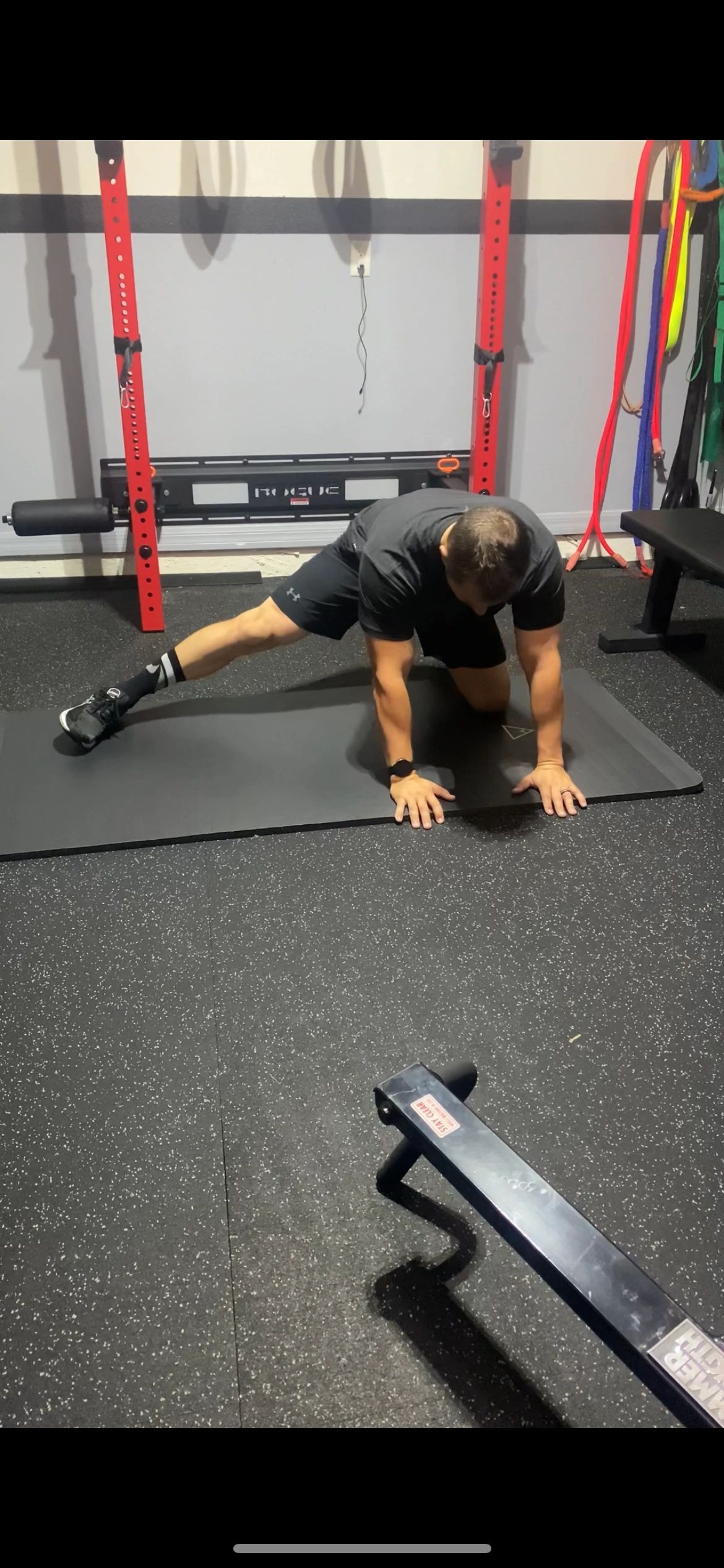 Athlete performing mobility preparation in a gym